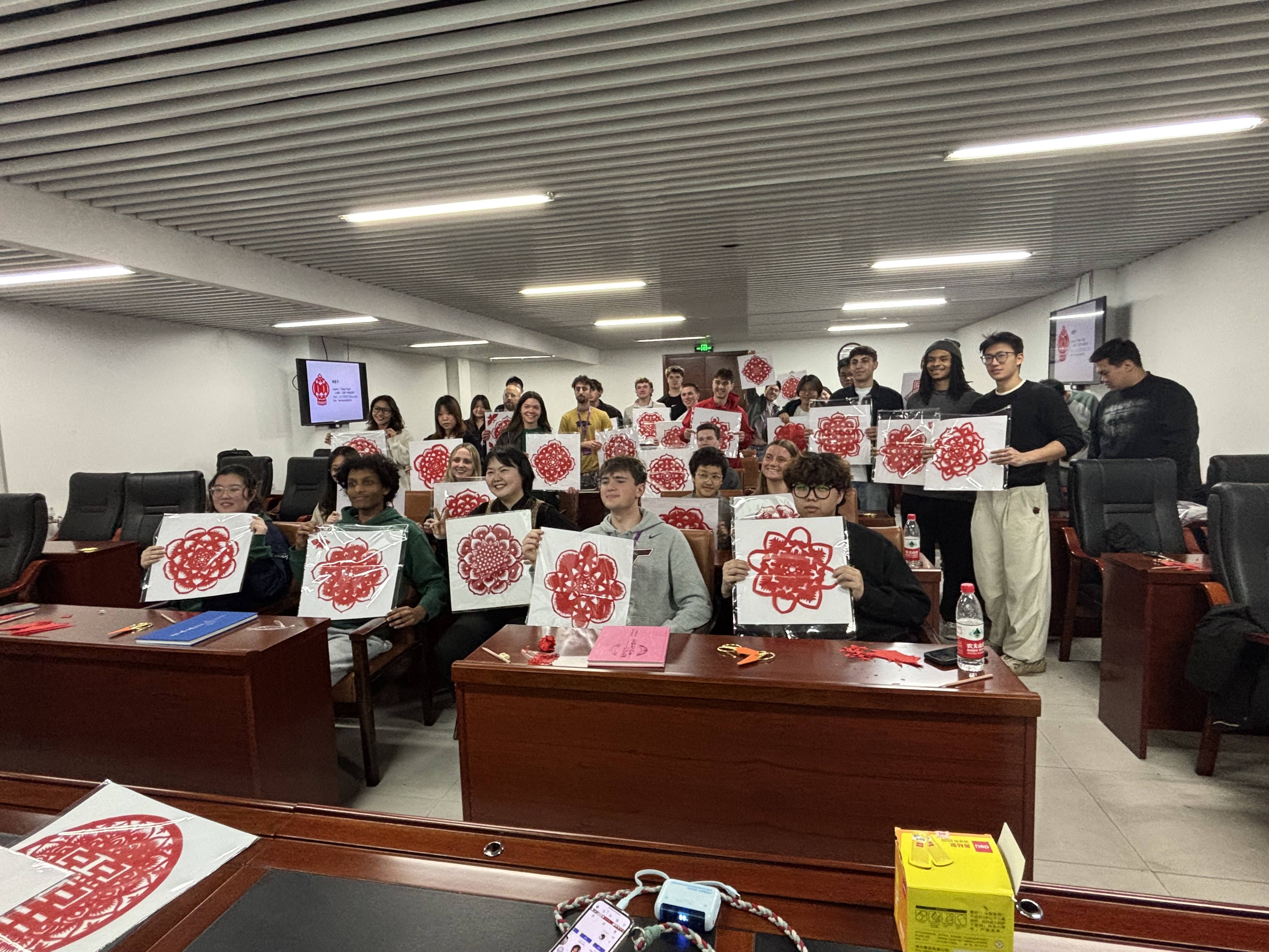 Students participating in a Chinese paper-cutting cultural activity